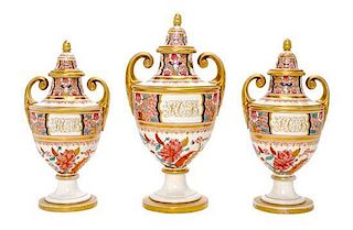 An English Porcelain Three-Piece Garniture, POSSIBLY DERBY, LATE 18TH CENTURY, Height of tallest 12 inches.