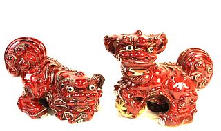 PAIR OF CHINESE SANG DE BOEUF GLAZED FOO DOGS