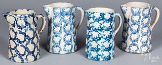Four blue and white spongeware pitchers, 19th c.