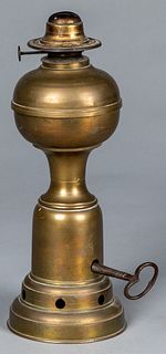 Clockwork brass fluid lamp, late 19th c.