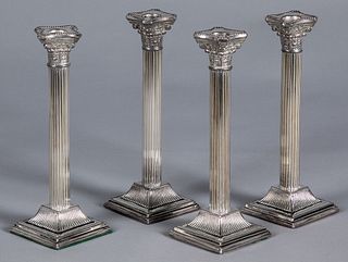 Set of four silver plated candlesticks, 10" h.
