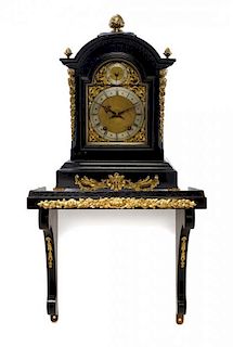 An English Gilt Metal Mounted Ebonized Bracket Clock, Height overall 32 inches.