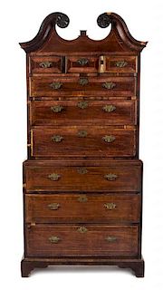 A George III Mahogany Featherbanded Chest on Chest, LATE 18TH CENTURY AND LATER, Height 82 1/4 x width 39 x depth 22 1/4 inches.
