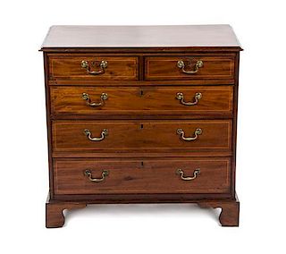 A George III Mahogany Chest of Drawers, EARLY 19TH CENTURY, Height 34 1/2 x width 36 x depth 20 inches.