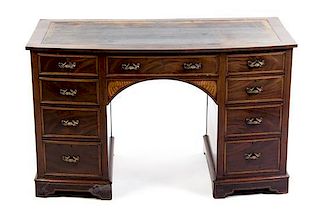 An English Marquetry and Mahogany Bow Front Desk, Height 28 1/2 x width 48 x depth 25 1/2 inches.