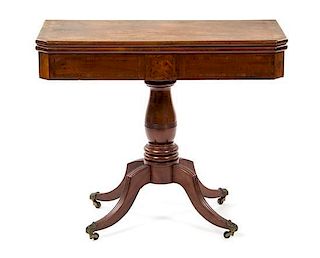 A Georgian Style Mahogany Flip-Top Game Table, Height 28 1/2 x width 46 1/2 x depth 59 1/2 inches (extended).