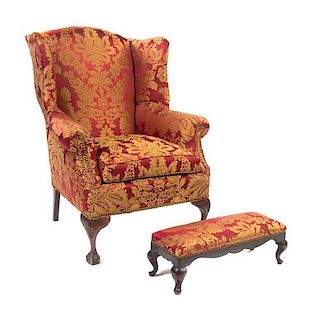 * A Georgian Style Wingback Armchair, Height 38 1/2 inches.