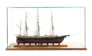 * An American Carved Wood and Fabric Ship Model, Width of case 49 1/4 inches.