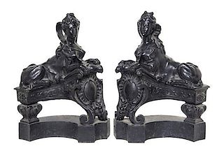A Pair of English Cast Iron Chenets, Height 21 1/4 inches.