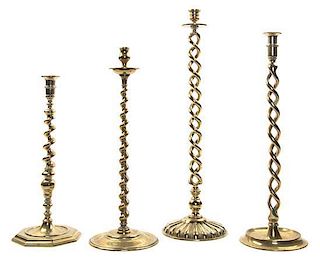 * Four English Brass Barley Twist Candlesticks, Height of tallest 22 1/2 inches.