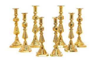 * Four Pairs of English Brass Diamond Beehive Candlesticks, Height of first pair 12 inches.