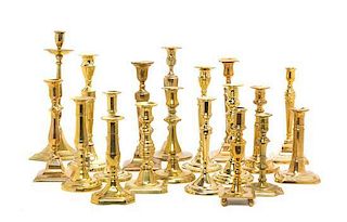 * A Collection of English Brass Candlesticks, Height of tallest 13 5/8 inches.