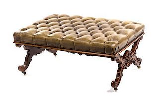 * A William IV Walnut and Leather Footstool, SECOND QUARTER 19TH CENTURY, Height 19 x width 42 x depth 30 inches.