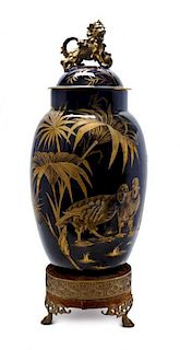 An English Cobalt Glass Vase and Cover, LATE 19TH CENTURY, Height overall 34 1/2 inches.