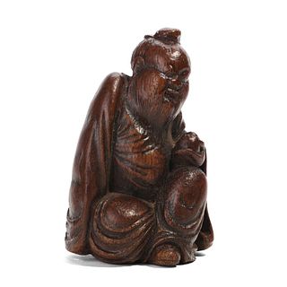 A BAMBOO CARVED FIGURE OF A SCHOLAR