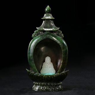 A CARVED WHITE JADE BUDDHA IN A SPINACH GREEN JADE STUPA