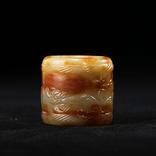 A CARVED JADE THUMB RING