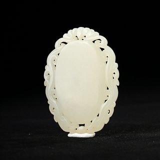 A WHITE CARVED JADE PENDANT
