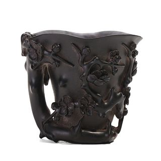 A HARDWOOD CARVED 'BIRD AND FLOWERS' CUP
