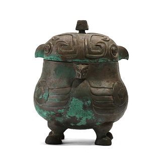 A BRONZE ANIMAL-FORMED VESSEL WITH FOUR LEGS