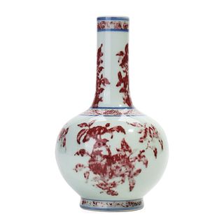 A BLUE AND WHITE AND COPPER RED VASE