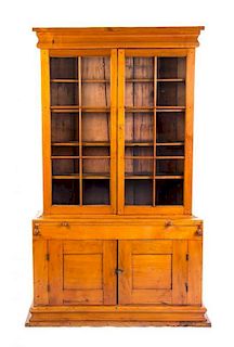 An American Cherry Secretary Bookcase, LATE 18TH CENTURY, Height 83 x width 52 x depth 18 inches.
