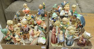 Two Tray Lots of Approximately Twenty-Two Small Hummels, to include "Stormy Weather", a boy with a backpack, nativity figures, two boys climbing fence