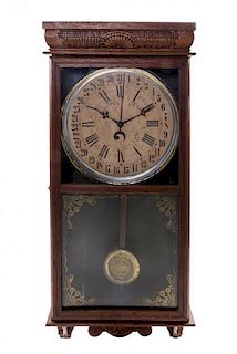 An American Oak Railroad Clock, INGRAHAM, Height 36 inches.