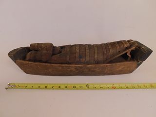 NATIVE AMERICAN BABY IN BOAT CARVING