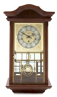 An Ansonia Wall Clock, Height 24 inches.