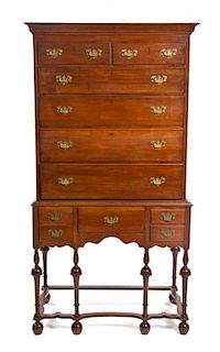 A William and Mary Style Walnut Chest on Stand, 19TH CENTURY, Height 78 3/4 x width 37 x depth 23 inches.