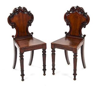 A Pair of Victorian Mahogany Hall Chairs, Height 34 1/4 inches.