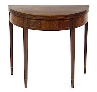 * An American Mahogany Flip-Top Table, LATE 19TH CENTURY, Height 29 3/4 x width 35 1/2 x depth 47 1/2 inches.