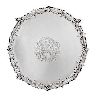 * A George III Silver Salver, Maker's Mark I Pellet C, London 1771, shaped circular form with a beaded rim, the border chased wi