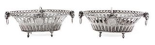 * A Pair of George III Silver Baskets, John Wakelin & William Taylor, London, 1790, each of oval, reticulated form, with ram mas
