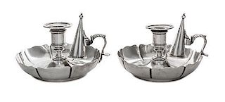 A Pair of Victorian Silver Chambersticks, Richard Sibley I, London, 1842, each having an urn shaped candle cup above a circular