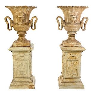 A Pair of Victorian Style Cast Iron Urns, Height overall 61 1/4 inches.