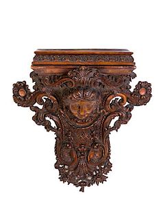* A Neoclassical Carved Oak Bracket, Height 21 inches.