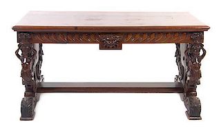 A Renaissance Revival Mahogany Library Table, Height 29 x width 59 1/4 x depth 31 3/4 inches.