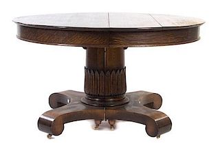 An Arts and Crafts Oak Table, Height 31 1/2 x diameter of top 54 inches.