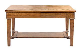 An Arts and Crafts Style Oak Library Table, Height 29 1/2 x width 57 3/4 x depth 29 1/2 inches.