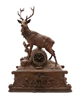 * A Black Forest Walnut Musical Mantel Clock, 19TH CENTURY, MOVEMENT BY JAPY FRERES, Height 25 3/8 x width 18 1/2 x depth 7 7/8