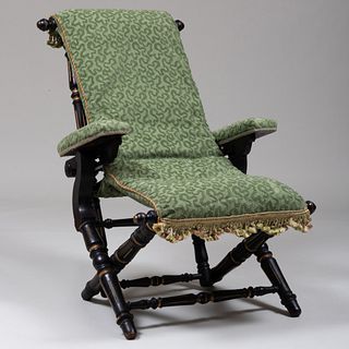 Renaissance Revival Ebonized, Parcel-Gilt and Upholstered Folding-Reclining Arm Chair, Stamped Hunzinger 