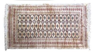 A Bokhara Wool Rug 7 feet x 4 feet 3 inches.