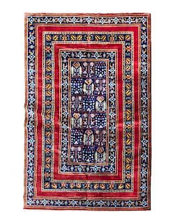 A Persian Wool Rug 9 feet 2 inches x 5 feet 11 inches.
