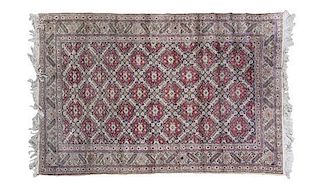 A Persian Wool Rug 5 feet 9 inches x 3 feet 10 inches.