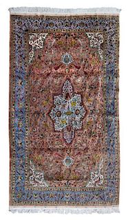 * A Persian Silk and Wool Rug 8 feet 9 inches x 5 feet 8 inches.
