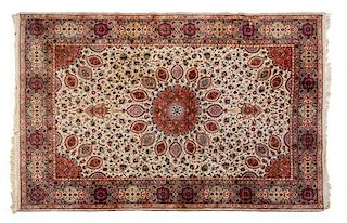 * A Tabriz Wool Rug 9 feet 7 inches x 6 feet 8 inches.