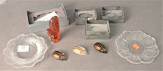 Six Piece Group of Lalique Art Glass, to include three colored glass beetles; one amber frosted glass squirrel; along with two small plates, both havi
