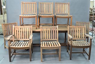  Nine Piece Brazilian Cherry Outdoor Patio Set, to include eight chairs, two arm chairs and six side chairs, along with a table having two 20" built i